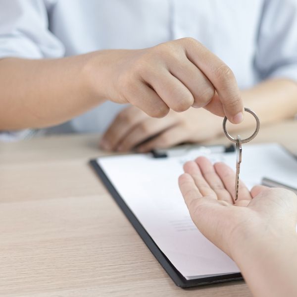 student getting key to their apartment