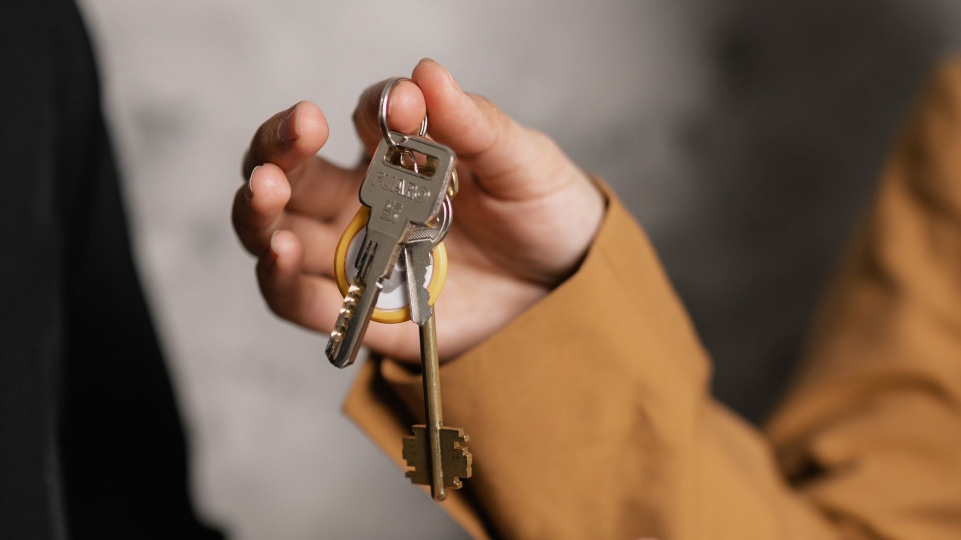 student receiving the keys to their apartment