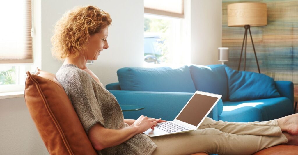 Woman working on a laptop.